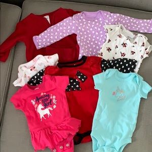 Bundle of 6 onesies plus bonus track suit! SOLD!